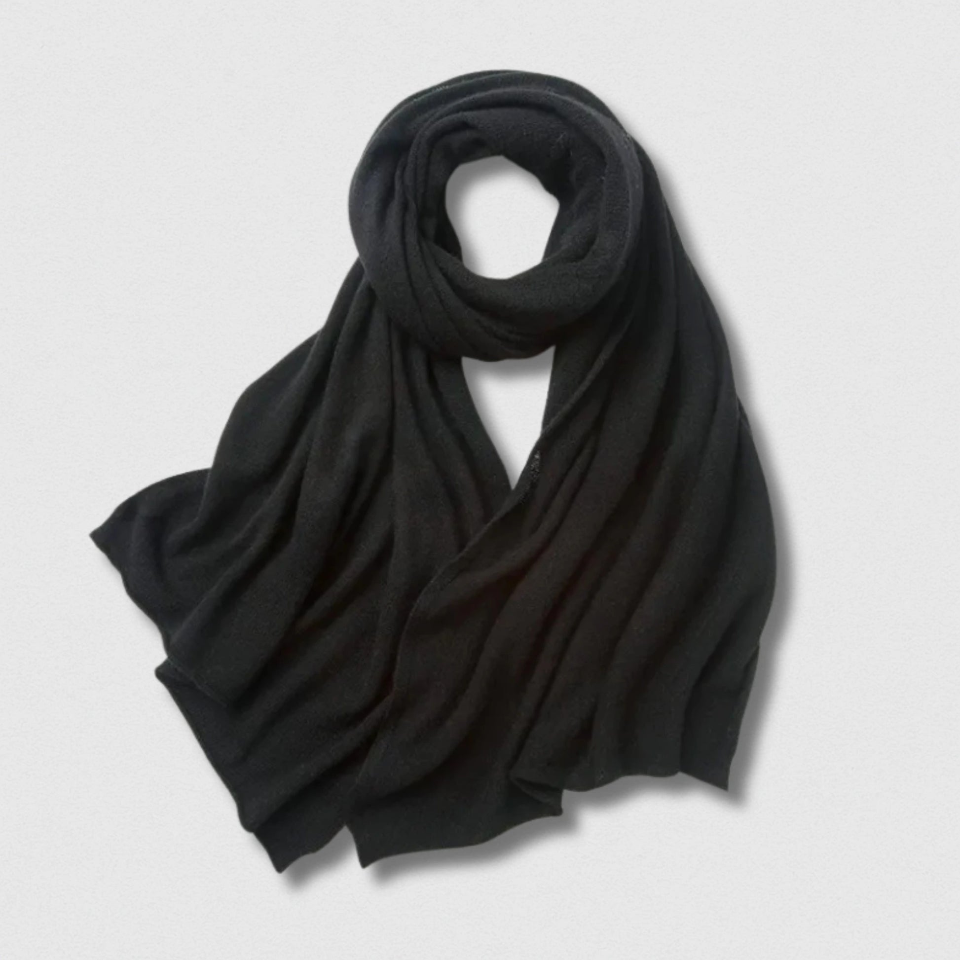Écharpe 100 % laine noir profond 180×32 cm, élégance intemporelle et douceur.