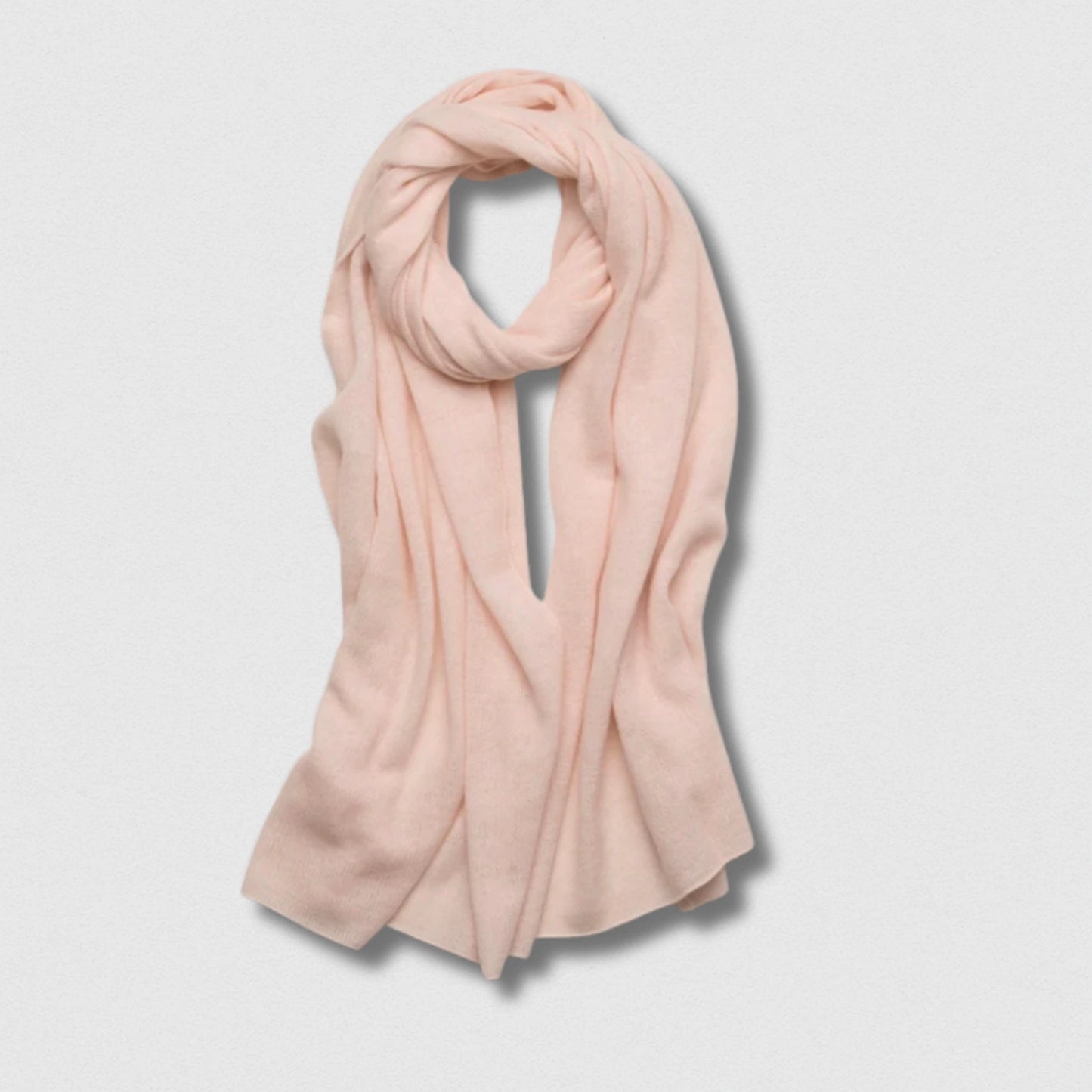 Écharpe 100 % laine rose poudré 180×32 cm, touche féminine et chaleur naturelle.